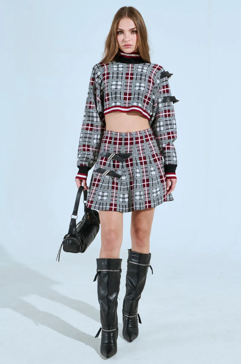 ALL EYES ON ME BUCKLE DETAIL KNIT MINI SKIRT IN RED