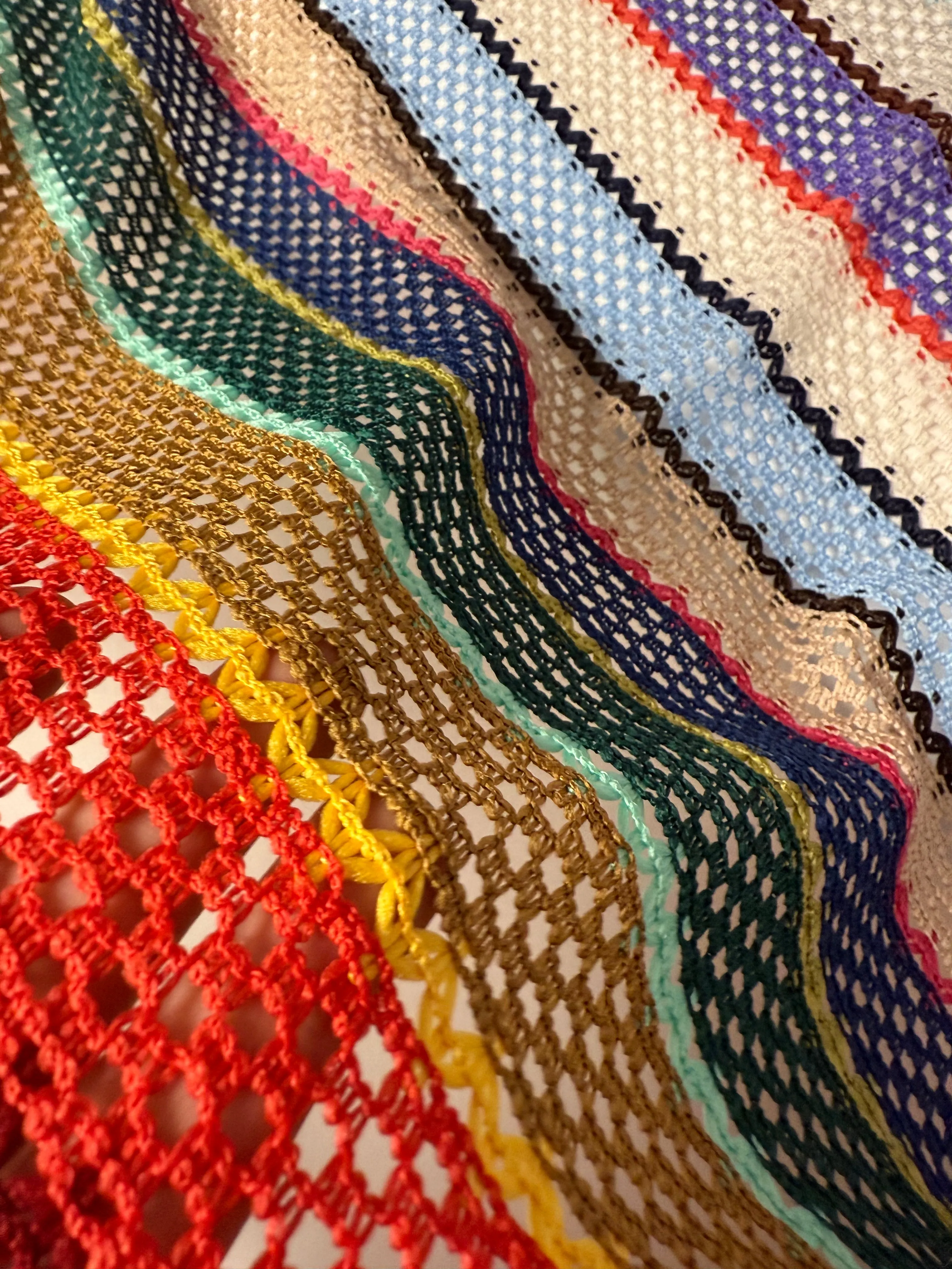 Colorful Knit Mesh Fabric with Striped Pattern – Vibrant and Textured Textile Design