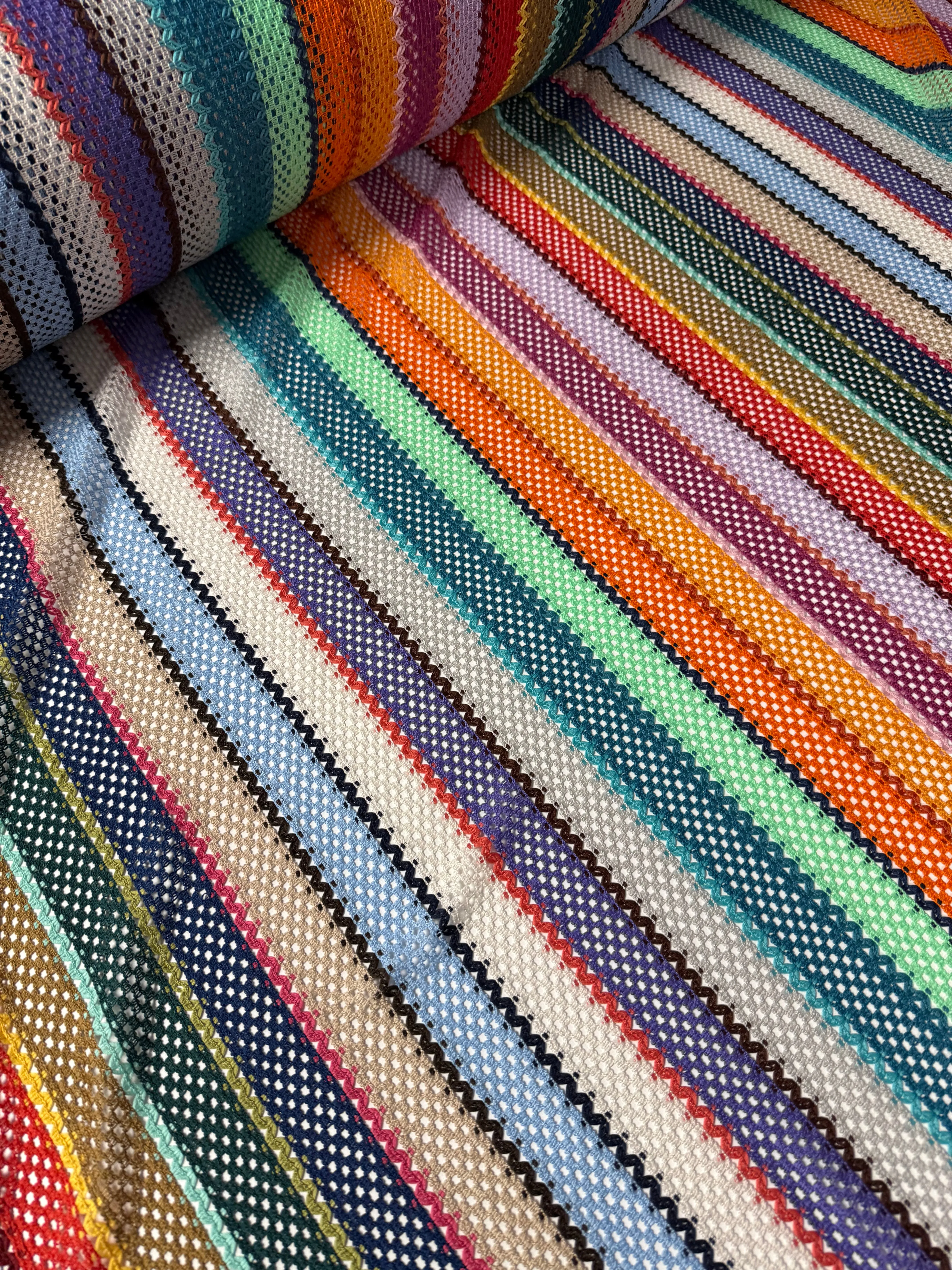 Colorful Knit Mesh Fabric with Striped Pattern – Vibrant and Textured Textile Design