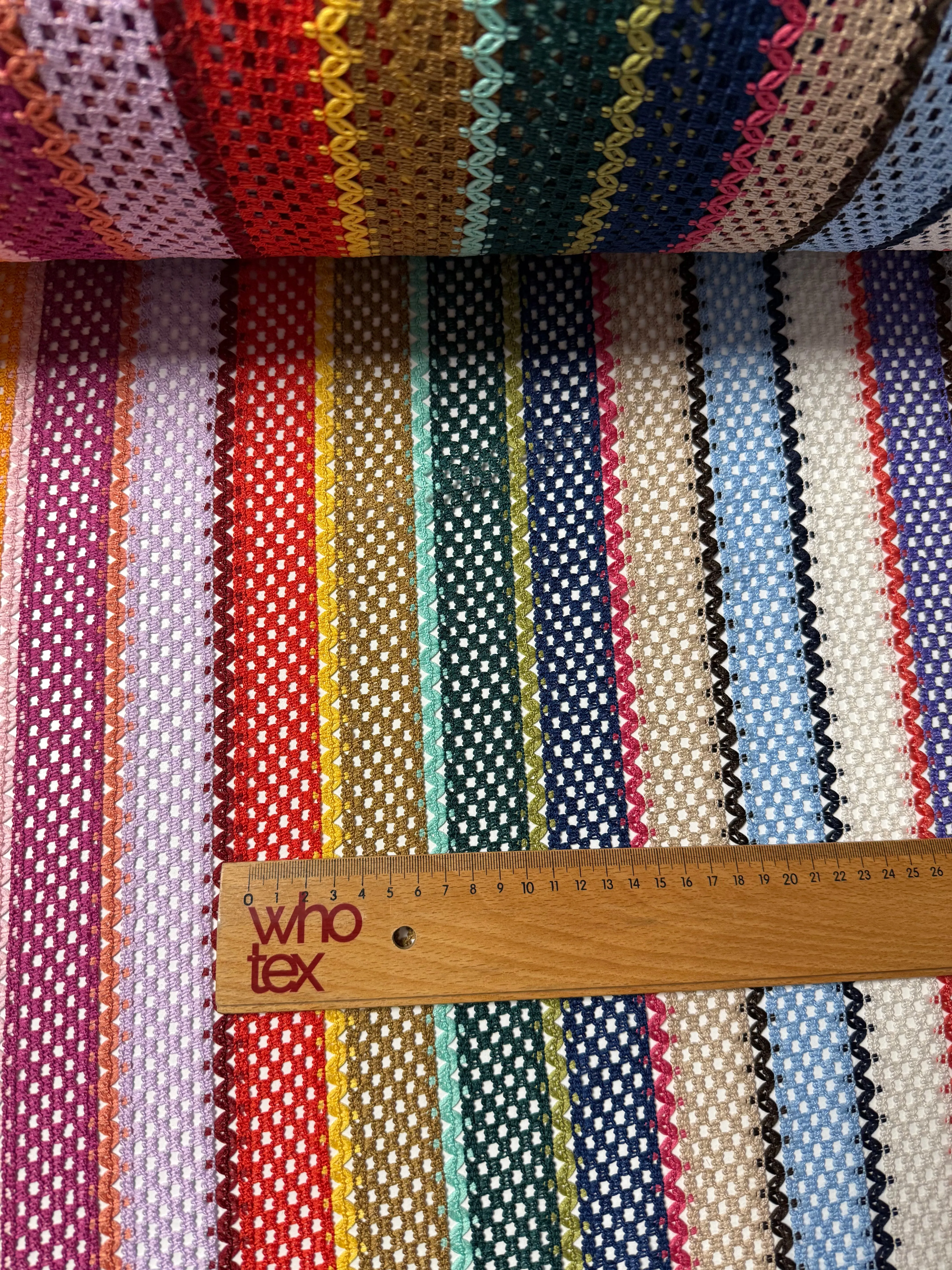 Colorful Knit Mesh Fabric with Striped Pattern – Vibrant and Textured Textile Design