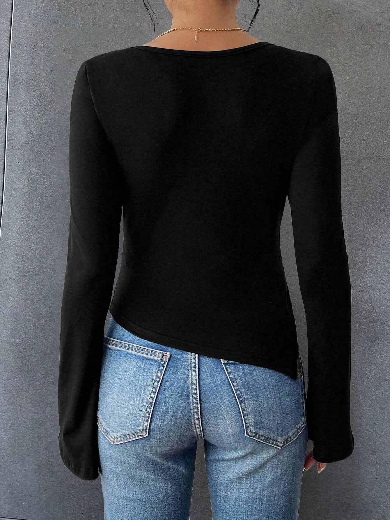 Elegant Asymmetrical Hem Long-Sleeve T-Shirt with Metal Button Accent