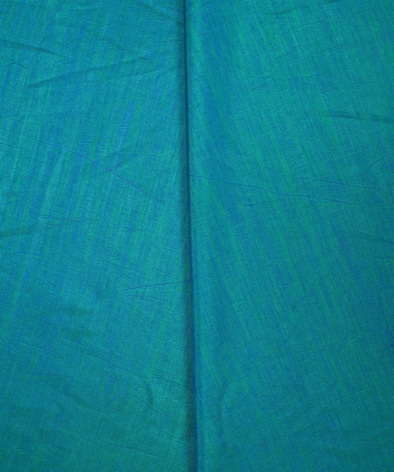 Peacock Blue Textured Semi Silk Fabric
