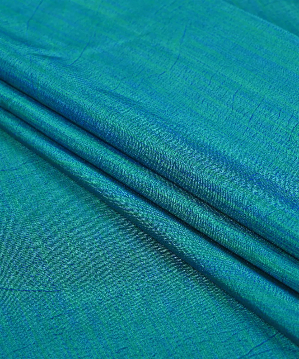 Peacock Blue Textured Semi Silk Fabric