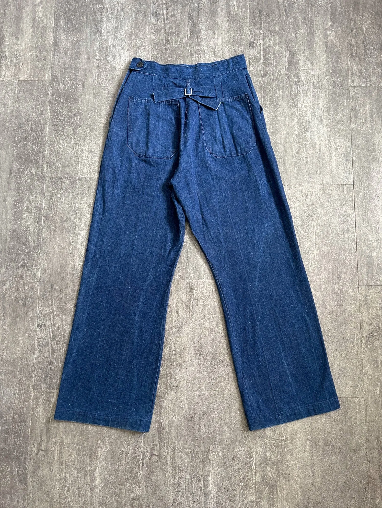 Vintage 1940s jeans . buckleback side button denim . 28-29 waist