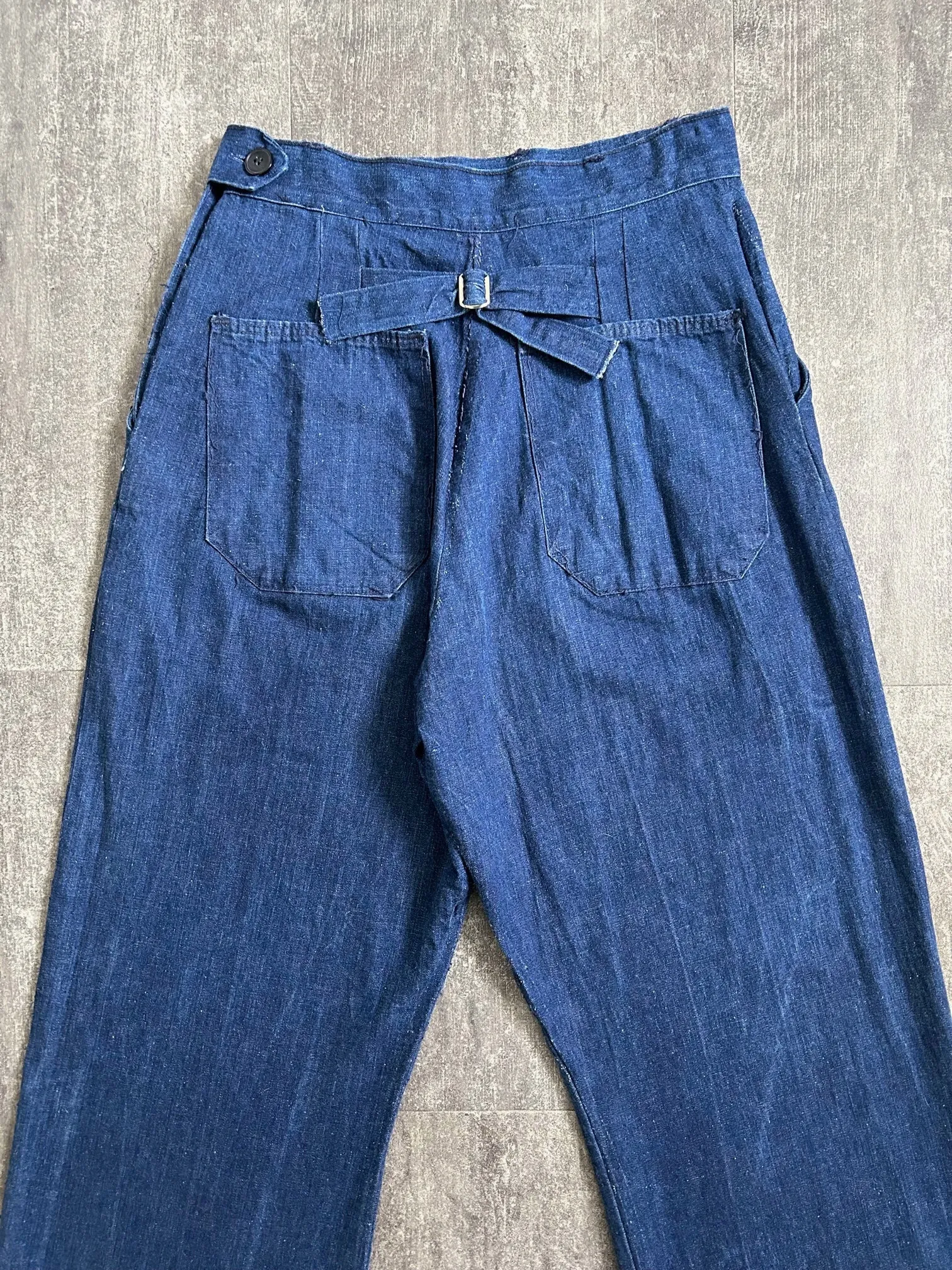 Vintage 1940s jeans . buckleback side button denim . 28-29 waist